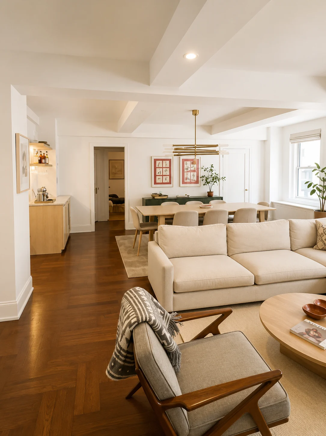 Warm, minimal living and dining space with neutral furnishings